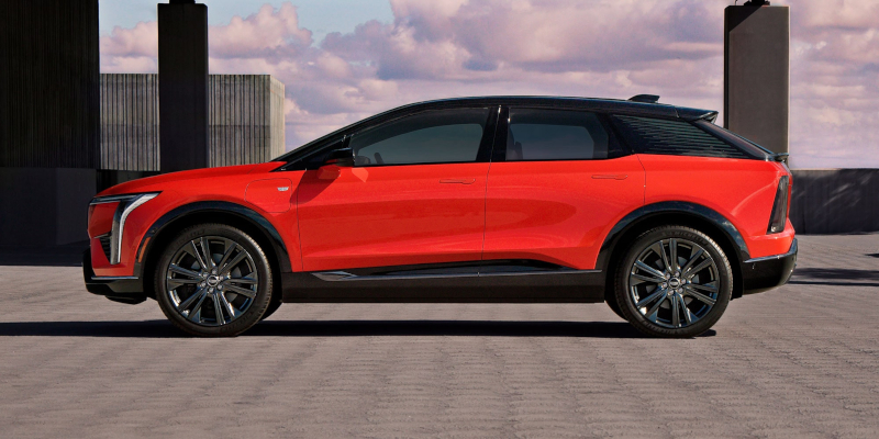 A red SUV parked in an urban setting.