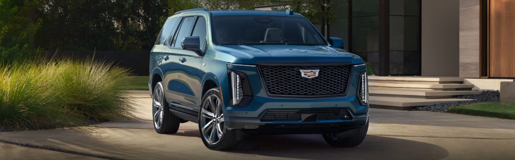 Cadillac SUV parked in driveway