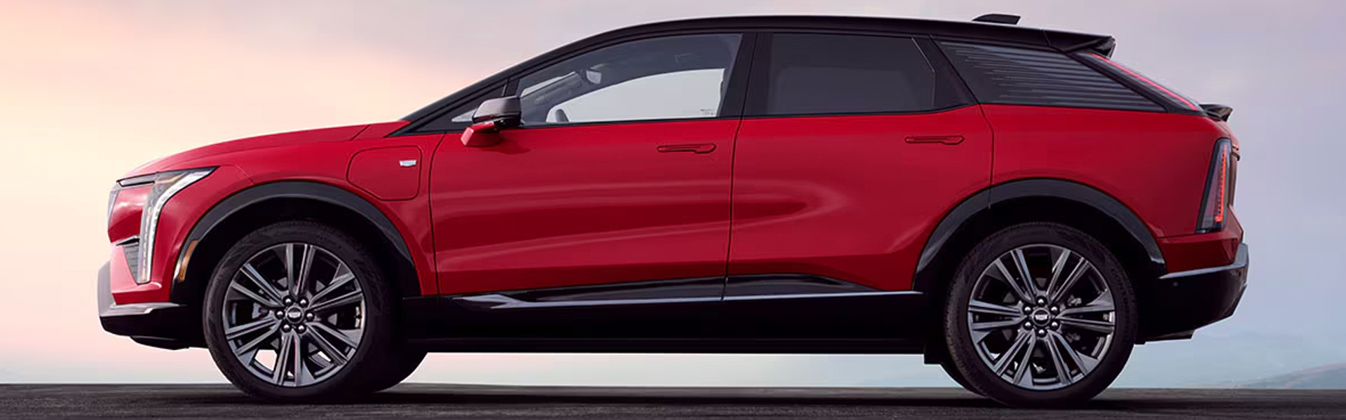 Red left-facing 2026 Cadillac OPTIQ